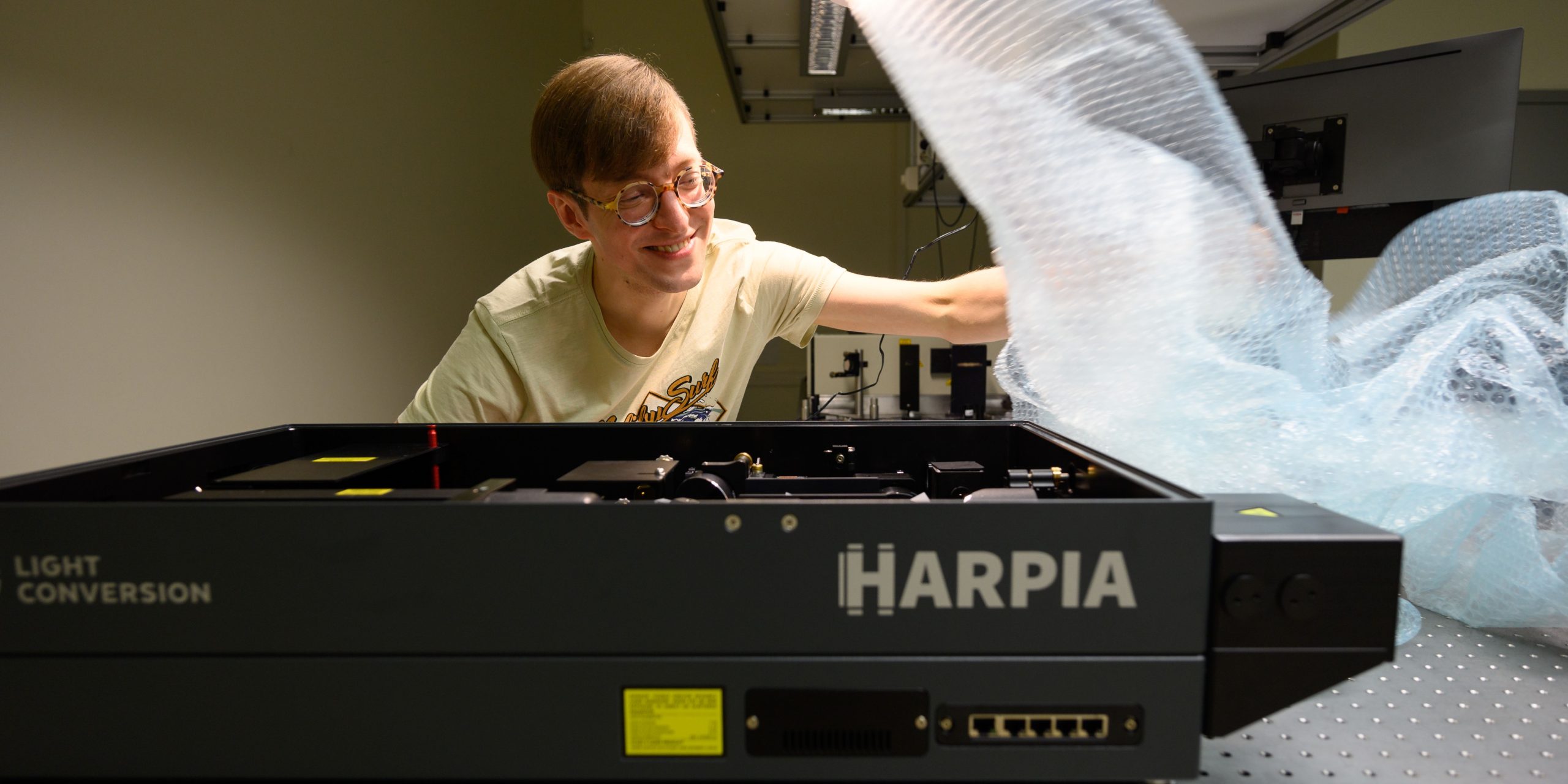 Dr. Kipras Redeckas next to HARPIA transient grating spectrometer that received Gold Honoree in Laser Focus World Innovation Awards 2022