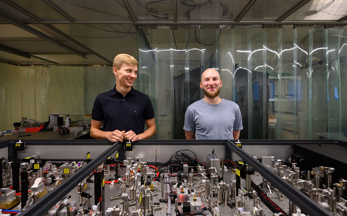 RnD engineers Vytenis Girdauskas and Ignas Balčiūnas next to one of the most recently built high-energy OPCPA systems, 2022